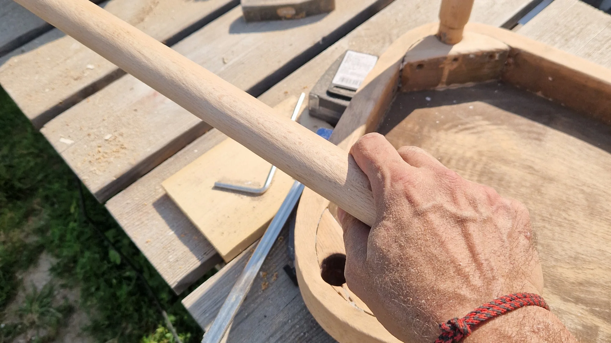 Hands fitting a turned handle